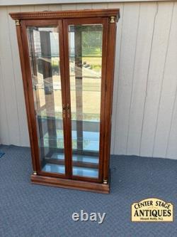 67753 Pulaski Traditional Glass Front Curio Cabinet with Brass Accents