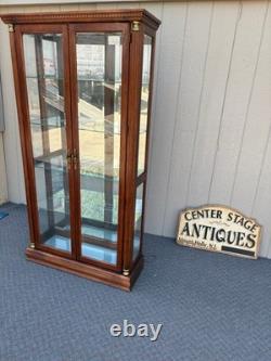 67753 Pulaski Traditional Glass Front Curio Cabinet with Brass Accents