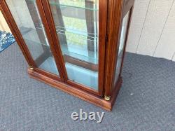 67753 Pulaski Traditional Glass Front Curio Cabinet with Brass Accents