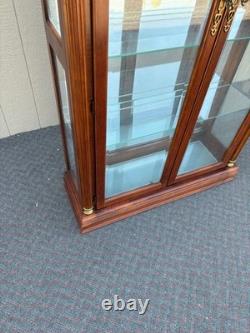 67753 Pulaski Traditional Glass Front Curio Cabinet with Brass Accents