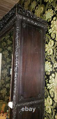 ANTIQUE 19c HEAVILY CARVED ROSEWOOD ARMOIRE with BEVELED MIRROR & PAW FEET