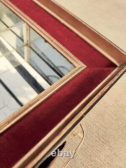 ANTIQUE ITALIAN GOLD PAINTED MIRROR CABINET WITH LIGHT. RED VELVET. 20 inches