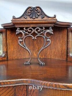 American Tiger Oak Bowed Bent Glass China Corner Cabinet with Griffins 1900s