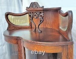 American Tiger Oak Bowed Bent Glass China Corner Cabinet with Griffins 1900s