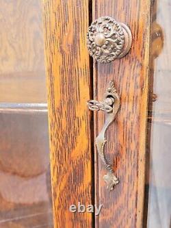 American Tiger Oak Bowed Bent Glass China Corner Cabinet with Griffins 1900s