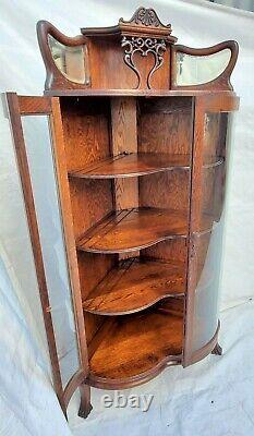 American Tiger Oak Bowed Bent Glass China Corner Cabinet with Griffins 1900s