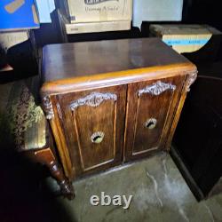 Antique Brown Carved Wood 2-Door Cabinet Raised Panel Knobs
