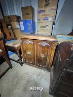 Antique Brown Carved Wood 2-Door Cabinet Raised Panel Knobs