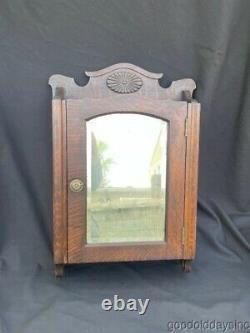 Antique Carved Oak Medicine Cabinet with Beveled Glass Mirror Circa 1910