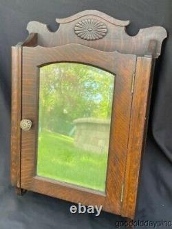 Antique Carved Oak Medicine Cabinet with Beveled Glass Mirror Circa 1910