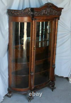 Antique Fancy Curved Glass Oak China Cabinet with carved Lions and claw feet