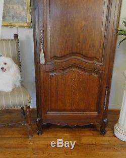 Antique French Country Armoire Tall Narrow Dark Oak Carved Key Shell