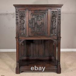 Antique French Gothic Carved Oak Cabinet Stand with Figural Panels Heraldic Door