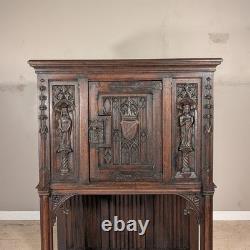 Antique French Gothic Carved Oak Cabinet Stand with Figural Panels Heraldic Door