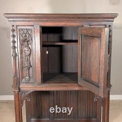 Antique French Gothic Carved Oak Cabinet Stand with Figural Panels Heraldic Door