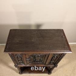 Antique French Gothic Carved Oak Cabinet Stand with Figural Panels Heraldic Door
