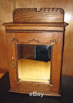 Antique OAK MEDICINE CABINET with beveled MIRROR Carved Crown charming