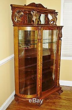 Antique Oak Bowed Glass China Cabinet with Claw Feet and Full Bodied Griffins