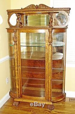 Antique Oak Bowed Glass China Cabinet with Claw Feet and Full Bodied Griffins