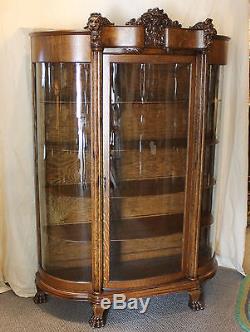 Antique Oak China Curio Cabinet with Detailed Lions Heads
