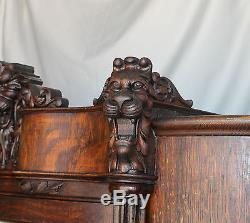 Antique Oak China Curio Cabinet with Detailed Lions Heads