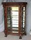 Antique Oak Curio China Cabinet Carved Ladies Mirrored Back Glass Shelves