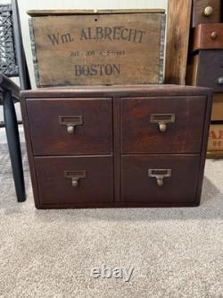 Antique Wooden 4-Drawer Cabinet with Stained Finish and Brass Handles