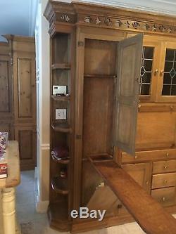 Antique kitchen cabinet hutch. Unknown maker. Ash brown color. Stained glass