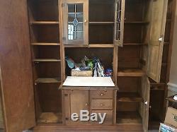 Antique kitchen cabinet hutch. Unknown maker. Ash brown color. Stained glass
