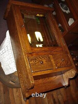 Antique oak Medicine cabinet Mission style with beveled edge mirror 1900's