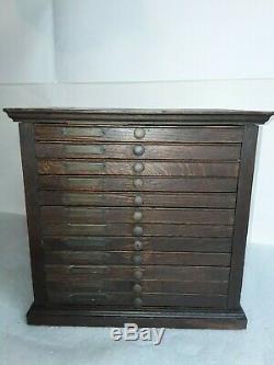 Antique oak dental medical cabinet. Raised panel vintage 12 drawer file c. 1900