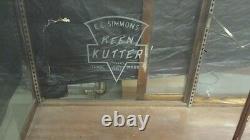Antique oak store showcase with Keen Kutter logo