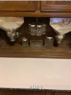 Authentic Hoosier Cabinet with Flour sifter and all original glass accessories