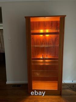 Beautiful midcentury- modern teak cabinet with lighting from House of Denmark