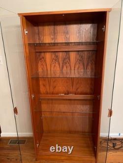 Beautiful midcentury- modern teak cabinet with lighting from House of Denmark
