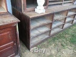 C1900 antique oak country store upright cabinet 85.75 h x 101 L x 30 deep