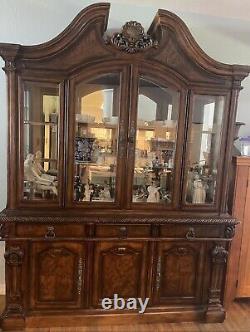 China cabinet with glass doors forest designs. Beautifully crafted wood withlights