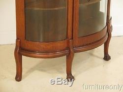 F28329E Antique Oak Bow Front China Cabinet w. Leaded Glass