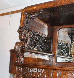 Great Oak China Curio Cabinet with carved Cherub holding hooded Canopy Original