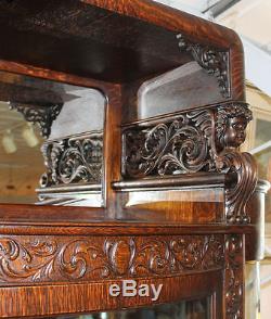 Great Oak China Curio Cabinet with carved Cherub holding hooded Canopy Original