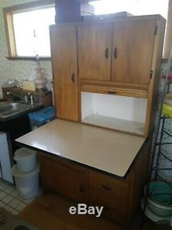 Hoosier cabinet with pullout table and lots of storage cabinets