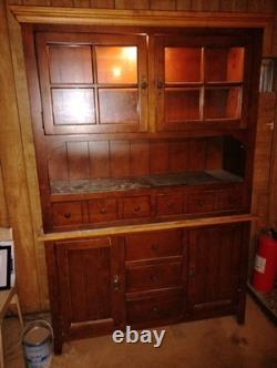 It's A Two Piece Hutch Cabinet with Two Doors
