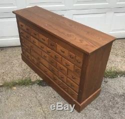 Multi Drawer Antique Oak Store Parts Cabinet 45 In. Wide