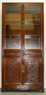 Pair Of Chinese Walnut Cabinets With Glass Doors And Carved Details