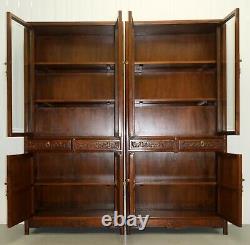 Pair Of Chinese Walnut Cabinets With Glass Doors And Carved Details