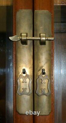 Pair Of Chinese Walnut Cabinets With Glass Doors And Carved Details