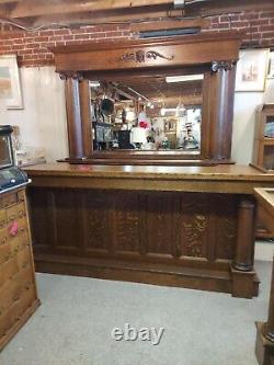 Quarter sawn oak back bar and front bar with carved victorian ladies head