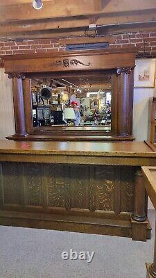 Quarter sawn oak back bar and front bar with carved victorian ladies head