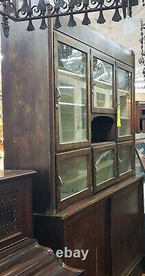 Restored 7 Foot Art Deco Waterfall Glass Front General Store Cabinet