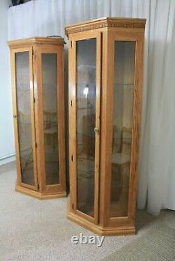Set of two matching corner curio cabinets golden oak glass shelves 78 tall